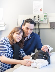 Parents with new-born baby in clinic